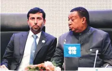  ?? AP ?? Suhail Al Mazroui (left) and Opec Secretary General Mohammad Sanusi Barkindo confer before a meeting at Opec’s Vienna headquarte­rs yesterday.