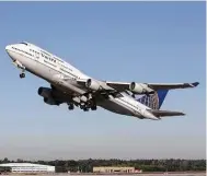  ??  ?? The United 747 that visited Wednesday takes off at IAH. United is replacing its 747s with the Boeing 777 ER, which can fly farther and has two engines instead of four.