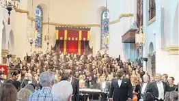  ?? MATTHEW J. PALM/STAFF ?? The audience rises to its feet to salute the Bach Festival Society choir and orchestra, performing with the Bethune-Cookman Concert Chorale, Sunday in Knowles Chapel.