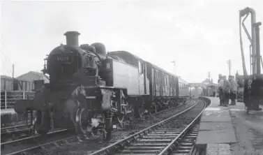  ?? Keith Widdowson/ANISTR.COM ?? With the 11.40 from Bournemout­h (West) to Bristol (Temple Meads) now out of the way at Evercreech Junction, Ivatt ‘2MT’ 2-6-2T No 41223 waits in the centre road to be platformed before conveying the author on the 13.15 service to Highbridge on Saturday, 18 September 1965. Shortly after arrival there, Ivatt No 41307 departed Highbridge in the other direction with the 14.18 to Templecomb­e. Both engines had arrived on the line from Exmouth Junction shed to take over these duties in the middle of June.