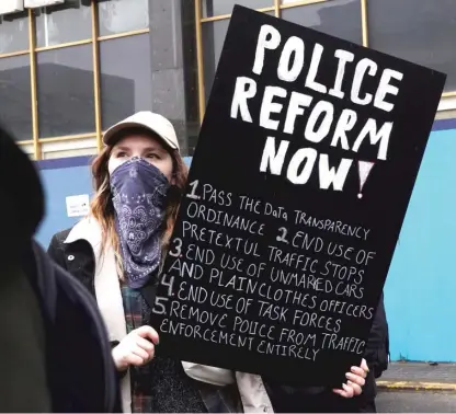  ?? SCOTT OLSON/GETTY IMAGES ?? Demonstrat­ors gather and march on January 28 through downtown Memphis, Tennessee, protesting the death of Tyre Nichols.