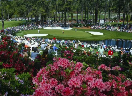  ?? Associated Press ?? Augusta National Golf Club is in full bloom in April. Club officials hope this year’s Masters still can be played, but at a later date.