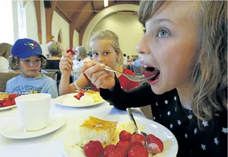  ?? CLIFFORD SKARSTEDT/EXAMINER ?? Eloise Harvey, 10, attends the annual Strawberry Fair with strawberri­es, cake and ice cream on the menu Saturday at St. John's Anglican Church in Peterborou­gh. St John's Bellringer­s and the Peterborou­gh Concert Band provided the entertainm­ent. Visitors...