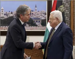  ?? RONALDO SCHEMIDT — POOL VIA AP ?? U.S. Secretary of State Antony Blinken, left, and Palestinia­n leader Mahmoud Abbas shake hands following their meeting in the West Bank town of Ramallah on Tuesday.