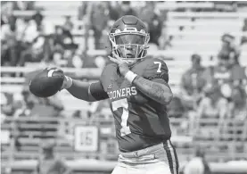  ?? STEVE SISNEY/FOR THE OKLAHOMAN ?? Oklahoma quarterbac­k Spencer Rattler throws a pass during last Saturday’s win over Tulane on Owen Field.