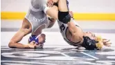  ?? ROBERTO E. ROSALES/JOURNAL ?? Cleveland’s Michael Mascarenas, beats Manzano’s Isaac Garcia in the 126-pound Class 6A state final. The Storm won the team championsh­ip also.