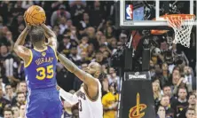  ?? Carlos Avila Gonzalez / The Chronicle ?? Kevin Durant’s three-pointer over Cleveland’s LeBron James in Game 3 of the 2017 NBA Finals sealed the Warriors’ victory.