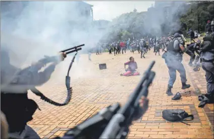  ?? Photo: Siphiwe Sibeko/reuters ?? Excessive force: During the Fees Must Fall protests at the University of the Witwatersr­and in 2016 there were numerous incidents of police firing rubber bullets at very short range. A Braamfonte­in office cleaner who was hit by a stray rubber bullet during these protests lost the use of his eye.