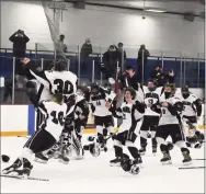  ?? Pete Paguaga/Hearst Connecticu­t Media / ?? North Haven celebrates its SCC/SWC Division III championsh­ips after beating Cheshire 3-0 at Bennett Rink on Saturday.