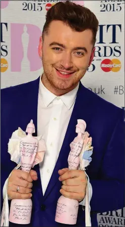  ??  ?? Winning ways: Sam Smith with his two Brit awards last month and, left, as a schoolboy