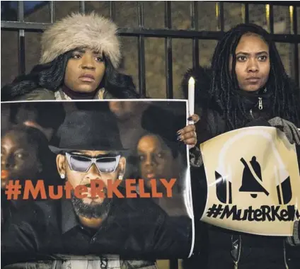  ?? Ashlee Rezin Associated Press ?? SIGNS of a movement in action: A vigil outside R. Kelly’s Chicago studio in 2019. Oronike Odeleye, below, co-founded the #Mute RKelly effort to shut down the singer after numerous allegation­s of sexual abuse.