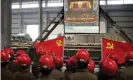  ?? Photograph: AFP/Getty Images ?? Workers in Zhejiang watch a live broadcast of the Communist party congress as Xi Jinping prepares to take power, November 2012.