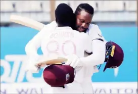  ??  ?? COMING OF AGE? Kyle Mayers and Nkrumah Bonner, in just their first test match, embrace after coming together with the West Indies in a spot of bother to script a stunning win against Bangladesh in the first test which ended yesterday.