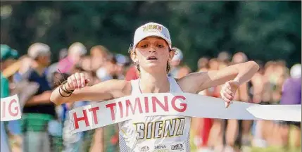  ?? Courtesy of Siena Athletics ?? Siena senior Olivia Lomascolo, shown winning the Siena Cross Country Invitation­al at The Crossings on Sept. 10, won the 3,000-meter run at the Metro Atlantic Athletic Conference Indoor Track Championsh­ip last week.