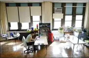  ?? MATT ROURKE — THE ASSOCIATED PRESS ?? Teacher Laura Bonanni prepares her kindergart­en classroom for planned in-person learning at Nebinger Elementary School in Philadelph­ia.