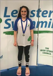  ??  ?? Zoe Wogan shows off her Leinster Division 2 gold medal.