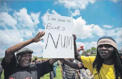  ??  ?? Troubles: Workers were unhappy with the National Union of Mineworker­s at the time of the 2012 wage strikes. They burnt NUM merchandis­e and tried to stop a rally from taking place. Photo: Delwyn Verasamy