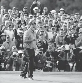  ??  ?? Patrick Reed reacts after winning the Masters on Sunday in Augusta, Ga. Reed took a victory over Rickie Fowler to claim his first major title. CHARLIE RIEDEL/AP