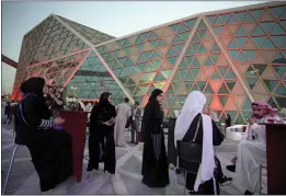  ?? AMR NABIL — THE ASSOCIATED PRESS FILE ?? Moviegoers wait to attend a screening at the King Abdullah Financial District Theater in Riyadh, Saudi Arabia.