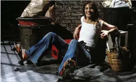  ?? Photograph: Gilbert UZAN/Gamma-Rapho/Getty Images ?? Jane Birkin poses in a cropped white T-shirt, flared jeans, roller-skates and a signature wicker basket.