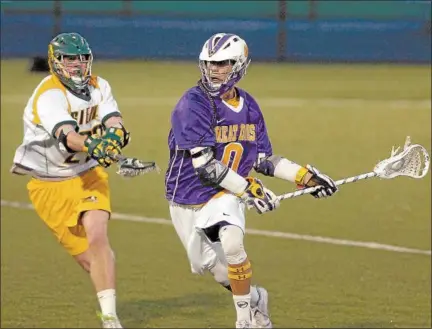  ?? THE RECORD FILE PHOTO ?? UAlbany's Lyle Thompson (0) goes up field as Siena's Brendan Meehan (23) defends at UAlbany on April 24, 2012.