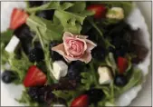  ??  ?? Mademoisel­le’s Creation: mixed greens, berries, Brie, toasted pecans and blackberry vinaigrett­e.