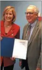  ?? PHOTO COURTESY OF MADISON COUNTY DEPARTMENT OF SOLID
WASTE AND SANITATION ?? Congresswo­man Claudia Tenney, left, presents Jim Zecca, director of the Madison County Department of Solid Waste, with an official certificat­ion from the Congressio­nal Record of her speech before Congress in which she honored Zecca’s service.