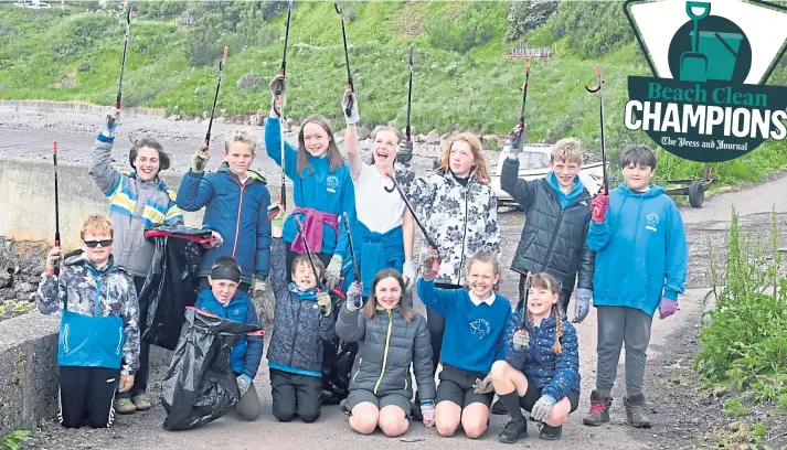  ??  ?? ECO WARRIORS: Youngsters from Catterline Primary School love going on to the beach to clean up rubbish during their spare time. Picture by Chris Sumner.