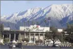  ?? AP photo ?? Snow caps the San Gabriel Mountains above the Rose Bowl Stadium in Pasadena, Calif., on Sunday, after a major winter storm swept through the state.