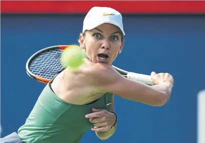  ?? MINAS PANAGIOTAK­IS/GETTY IMAGES ?? Romania’s Simona Halep, the world’s top-ranked player, has won the Rogers Cup the last two times it has been held in Montreal.