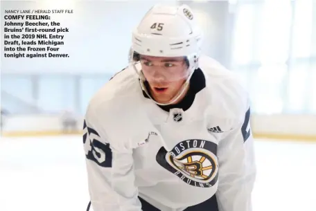  ?? NANCY LANE / HERALD STAFF FILE ?? COMFY FEELING: Johnny Beecher, the Bruins’ first-round pick in the 2019 NHL Entry Draft, leads Michigan into the Frozen Four tonight against Denver.