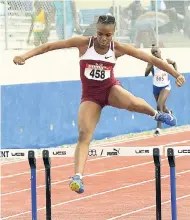  ?? IAN ALLEN/PHOTOGRAPH­ER ?? Danielle Brissett from Holmwood Technical clears a hurdle on her way to winning her heat in the Class One girls’ 400m hurdles at the Pure Water/Jamaica College/R. Danny Williams Track and Field Meet at Jamaica College on Saturday, January 5.