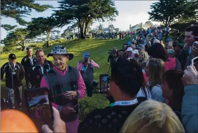  ?? DAVID ROYAL — MONTEREY HERALD CORRESPOND­ENT ?? Fans shoot photos of Bill Murray at the 10th green at Monterey Peninsula Country Club during the AT&T Pebble Beach Pro-Am in 2020.