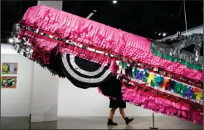  ?? AP Photo/Jae C. Hong ?? Gypsy Rose Pinata: In this June 29, photo, 'Gypsy Rose Pinata,' by Justin Favela is displayed during an exhibition titled, 'The High Art of Riding Low' at the Petersen Automotive Museum in Los Angeles.
