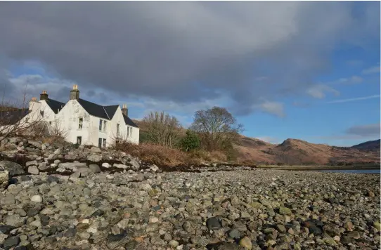  ??  ?? Far left: Lachlan Stewart has transforme­d his childhood home of Tulach Ard with the help of wife Annie and son Lachlan. Left: The cosy kitchen with Aga. Below: The 18thcentur­y property sits on the shores of Loch Alsh.