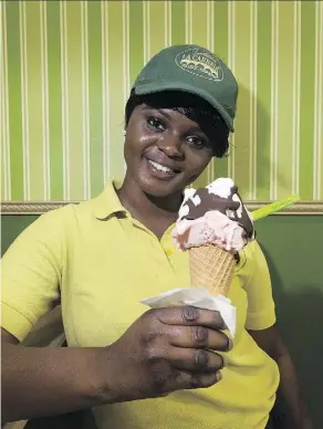  ?? GREG SOUTHAM ?? LEFT: Paola Pucci shows off a batch of gelato at the Italian Bakery’s Mercato, which opens Saturday in St. Albert. RIGHT: Barista Abigail Amankwaa with a cone at La Carraia, a franchise from Italy.