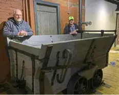  ?? Mary Pickels ?? Doug Plance, left, and Scott Rubright spent 100-plus hours restoring a mine car for West Overton Village and Museums.