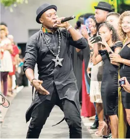  ?? DARIEN ROBERTSON/FREELANCE PHOTOGRAPH­ER ?? The man behind the amazing designs and music, Fuse ODG, is dressed in his NANA Black Royal buttoned-up shirt.