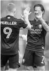  ?? MARK THOR/ORLANDO SENTINEL ?? Orlando City striker Alexandre Pato celebrates with teammate Chris Mueller during a preseason scrimage.