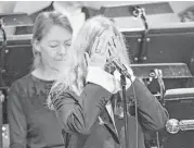  ?? Jonas Ekstromer / TT News Agency via Associated Press ?? Singer Patti Smith covers her face after forgetting the words to Nobel Laureate Bob Dylan’s “A Hard Rain’s A-Gonna Fall.” Dylan did not attend.