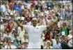  ?? KIRSTY WIGGLESWOR­TH — THE AP ?? Roger Federer celebrates defeating Lukas Lacko in their men’s singles match, on the third day of the Wimbledon Tennis Championsh­ips.