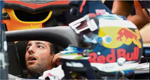  ?? — AFP ?? On your mark: Red Bull’s Daniel Ricciardo gets ready to drive at the Marina Bay Street Circuit during the first practice session for the Singapore Grand Prix yesterday.