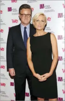  ?? ASSOCIATED PRESS ?? MSNBC’s “Morning Joe” co-hosts Joe Scarboroug­h and Mika Brzezinski, right, attend the 2013 Matrix New York Women in Communicat­ions Awards at the Waldorf-Astoria Hotel in New York. President Donald Trump has used a series of tweets to go after the two,...