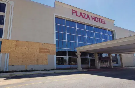  ?? (Pine Bluff Commercial/Eplunus Colvin) ?? During the February winter storm, the shuttered Plaza Hotel suffered additional damage to its facade after rain leaked and a pipe burst, causing the front wall to crumble further.