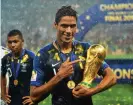  ?? Photograph: NurPhoto/Getty Images ?? France defender Raphaël Varane poses with the World Cup trophy in 2018.