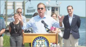  ?? Ned Gerard / Hearst Connecticu­t Media ?? Gov. Ned Lamont speaks at a news conference in Stratford on Friday. Lamont was joined by other state and local officials to sign a legislativ­e bill that will implement new policies designated to support continued growth of the state’s shellfish industry.