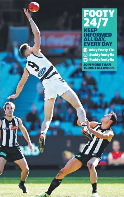  ??  ?? THE BIG MAN FLIES: Geelong’s Zac Smith jumps over Darcy Moore at a ruck contest. Picture: GETTY IMAGES