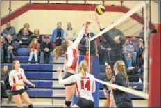  ?? PETER OLESKEVICH PHOTO ?? Jamie Crocket tries to deliver a kill versus U SPORTS No. 5 Dalhousie defenders.