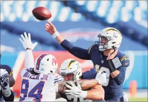  ?? Timothy T Ludwig / Getty Images ?? The Chargers’ Justin Herbert releases a pass during last week’s game against the Bills.