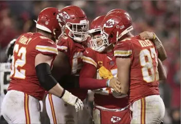  ?? AP photo ?? Chiefs quarterbac­k Patrick Mahomes is helped by teammates after a play during the second half of Kansas City’s 27-20 victory over the Jacksonvil­le Jaguars in a divisional playoff game Saturday.